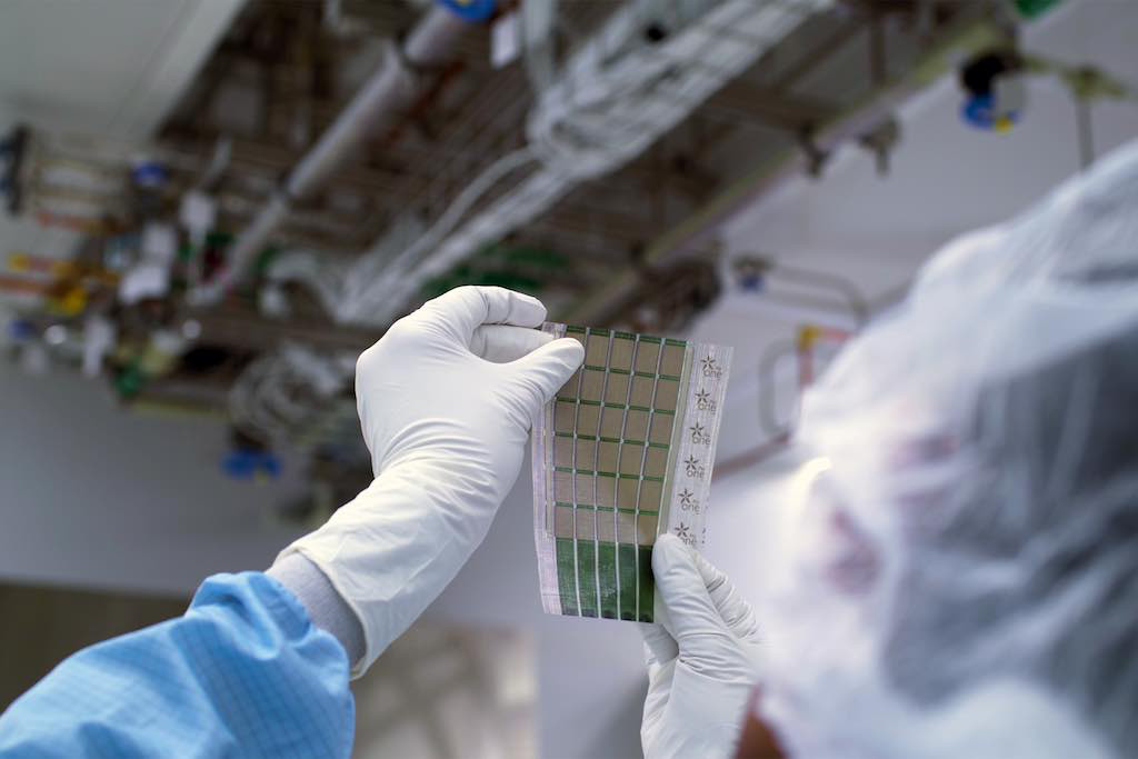 MIT researchers have developed a scalable fabrication technique to produce ultrathin, lightweight solar cells that can be stuck onto any surface. Courtesy: Melanie Gonick, MIT